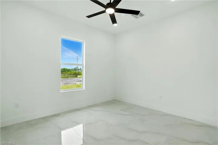 Unfurnished dining area with light marble finish floors, recessed lighting, and a chandelier