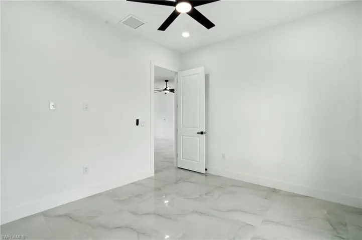 Garage with electric panel and a garage door opener