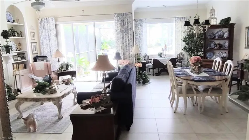 Sunroom featuring a chandelier and plenty of natural light