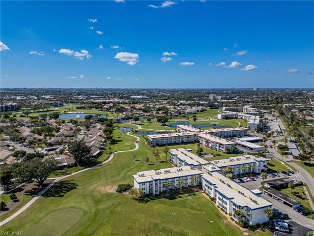 Bird's eye view of a golf club and a nearby body of water