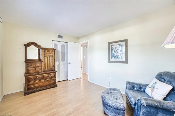 Bedroom with light wood-style floors and baseboards