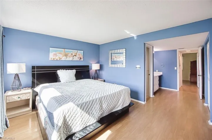 Master Bedroom featuring light wood-style floors and a textured ceiling