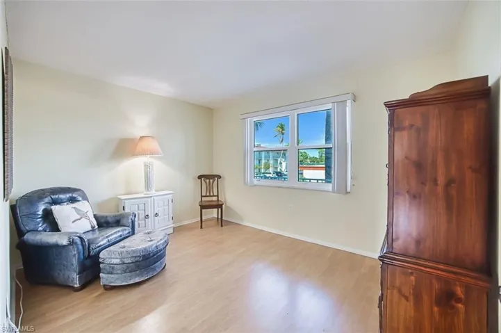 Bedroom featuring light wood-style flooring and baseboards