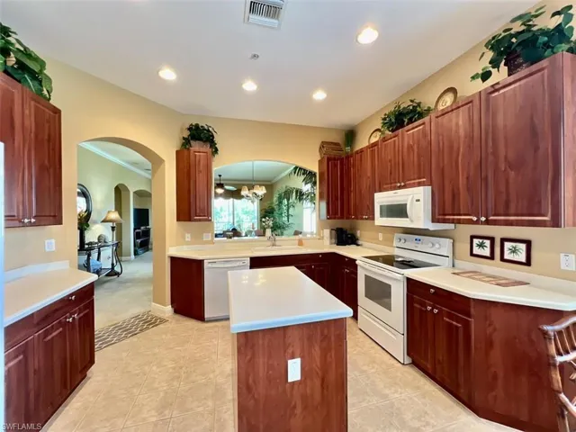 Kitchen featuring a center island and loads of cabinet and counter prep space
