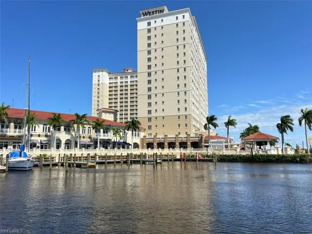 Marina promenade with waterfront shops and restaurants