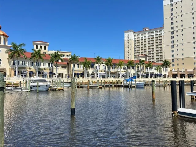 Marina promenade with waterfront shops and restaurants