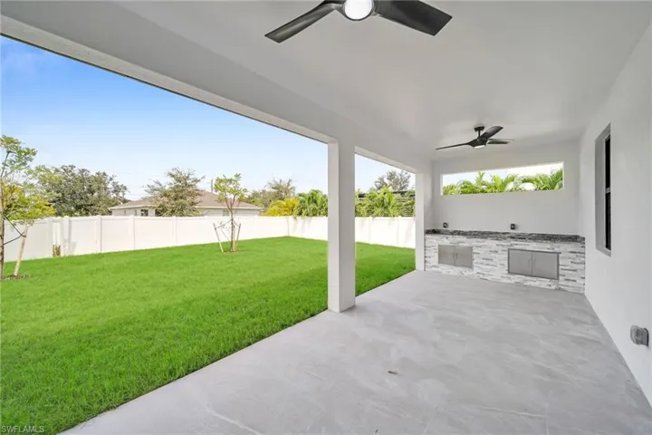 View of patio featuring ceiling fan