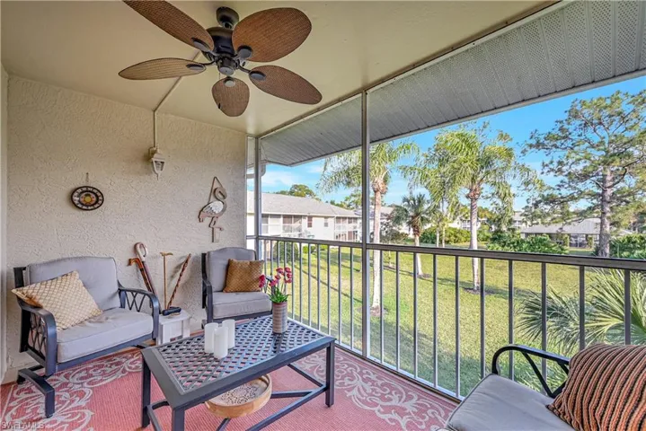 Sunroom with a ceiling fan
