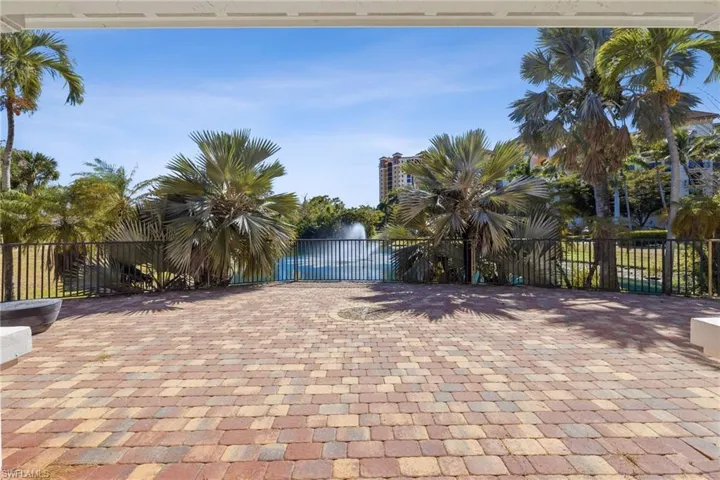 View of patio with a gate