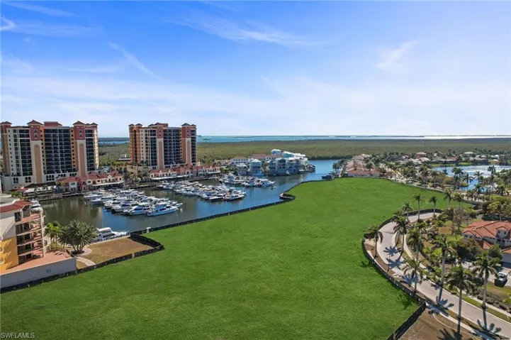 Aerial view of a nearby body of water and a marina