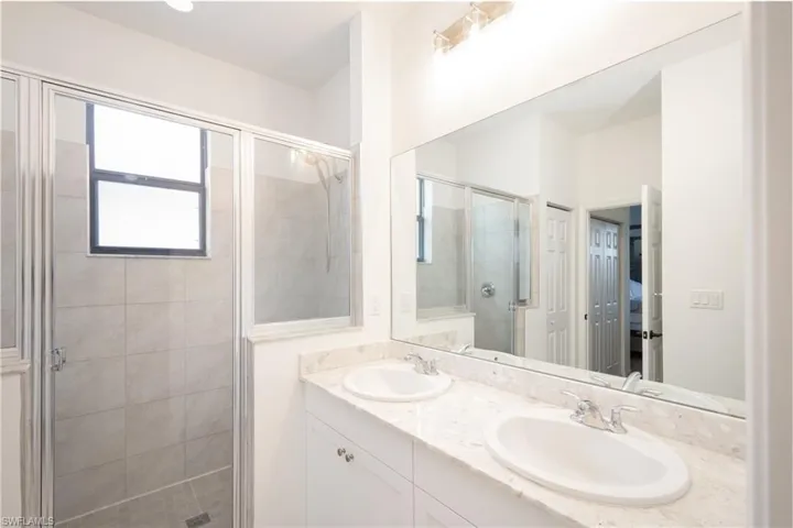 Bathroom with vanity and an enclosed shower