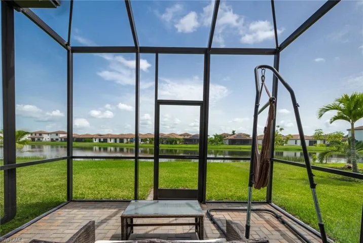 Unfurnished sunroom with a water view