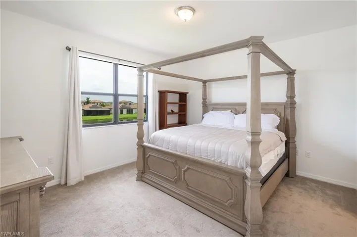 Owner's suite carpeted bedroom