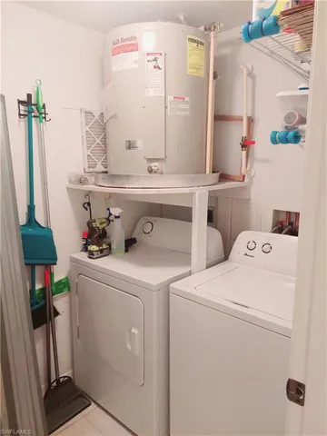 Separate utility and laundry room off the main foyer