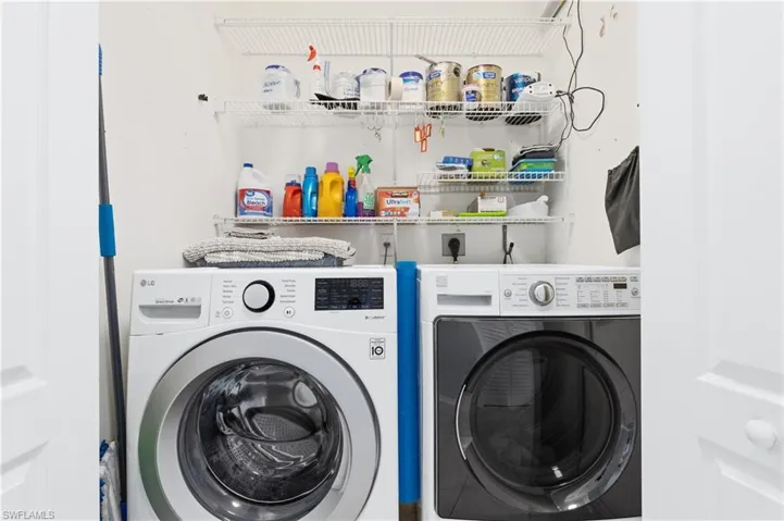 Laundry area with washer and clothes dryer
