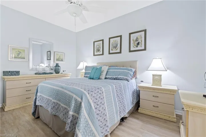 Primary Bedroom featuring light wood-style flooring and ceiling fan