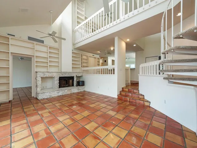 Living Room with Wood Burning Fireplace Towards Dining, Kitchen, Master Suite and Upstairs Suite and Loft