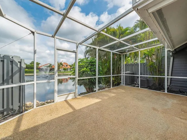 Rear Lake Front Screened Patio with of Lake and Water Feature
