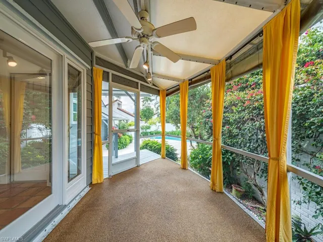 Covered and Screened Porch with view over Pool Area