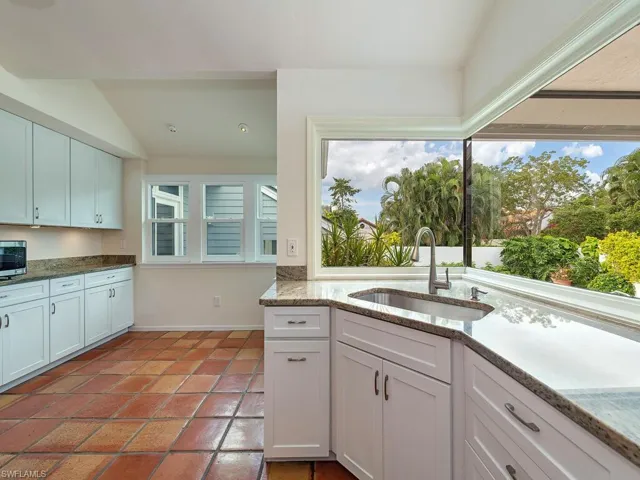 Light and Bright Kitchen with view over Pool Deck Area