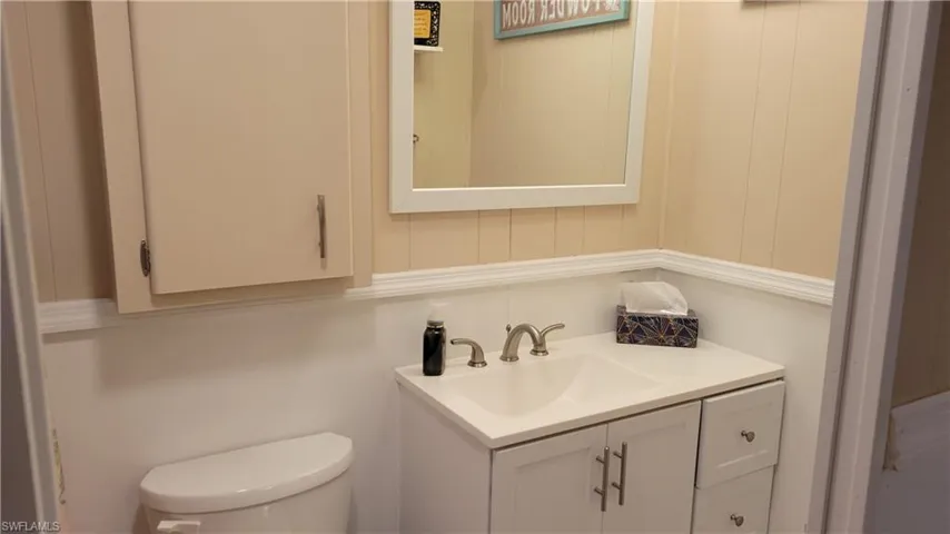 Bathroom featuring toilet and vanity