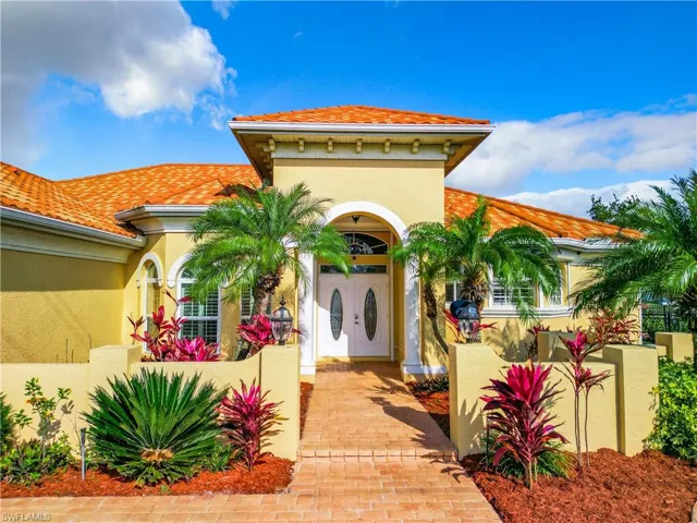 Mediterranean / spanish-style house with stucco siding and a tiled roof
