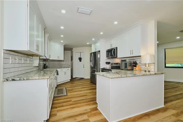Spacious Kitchen with Stainless Steel Appliances.
