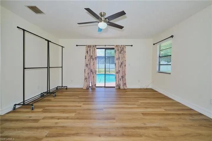 Bedroom/Mother-in-Law Suite with sliding glass doors to the pool.
