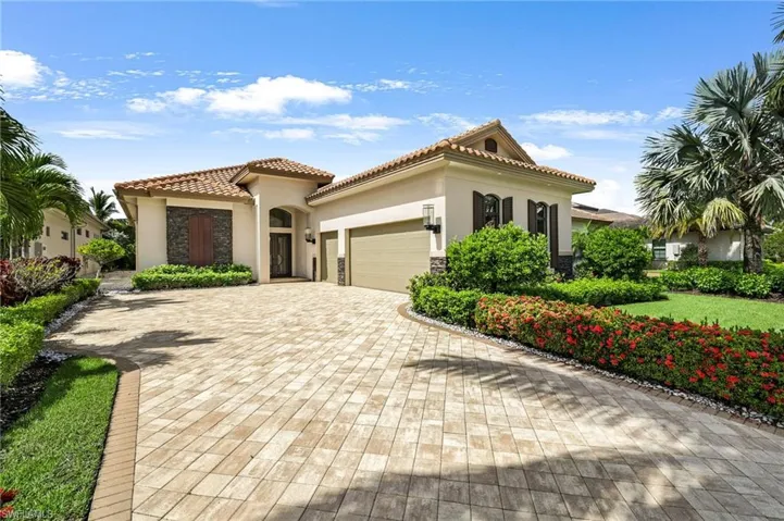 Mediterranean / spanish home featuring a garage