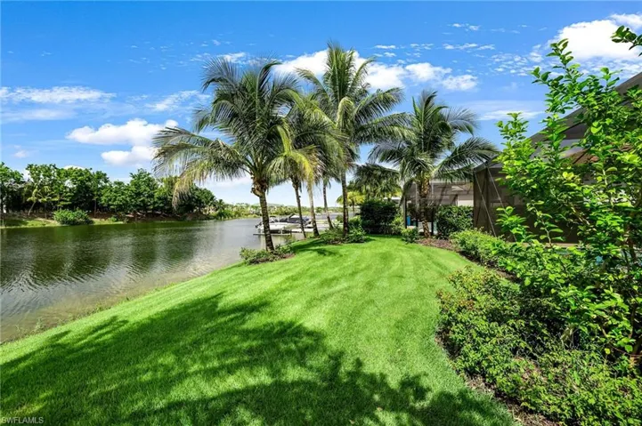 View of yard with a water view