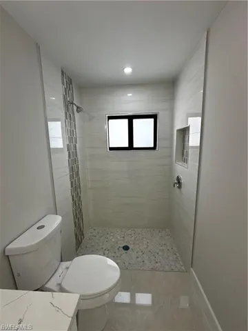 Full bathroom with a stall shower and vanity