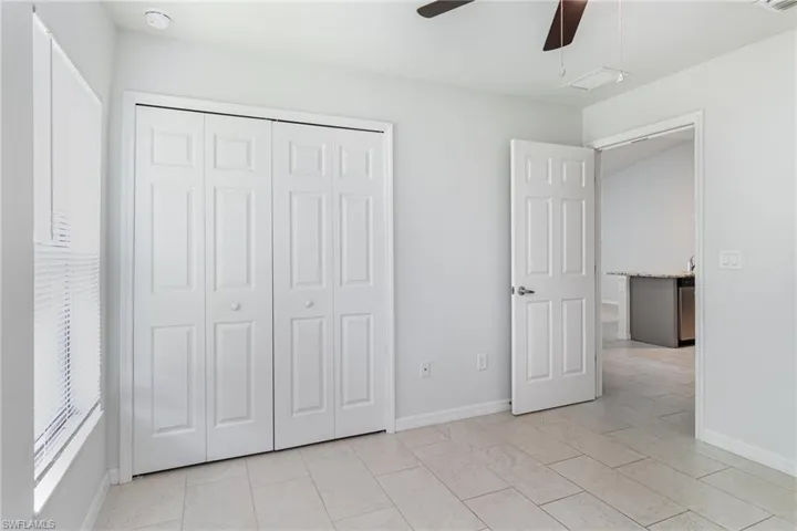 Full bath featuring vanity and shower / bath combination with curtain