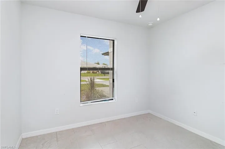 Unfurnished bedroom with a closet and ceiling fan