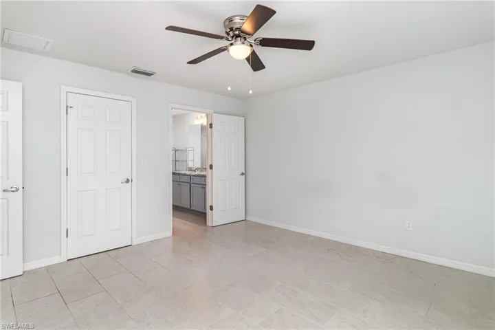 Unfurnished bedroom with baseboards and a ceiling fan