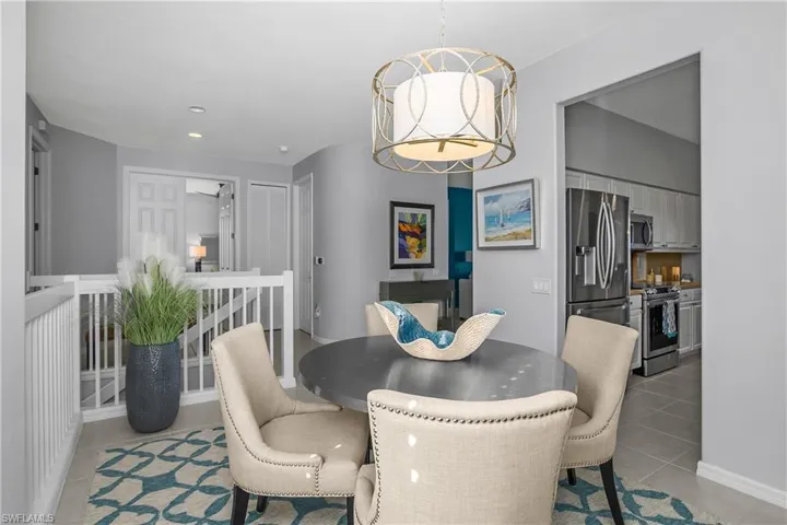 Dining room featuring recessed lighting and light tile patterned flooring