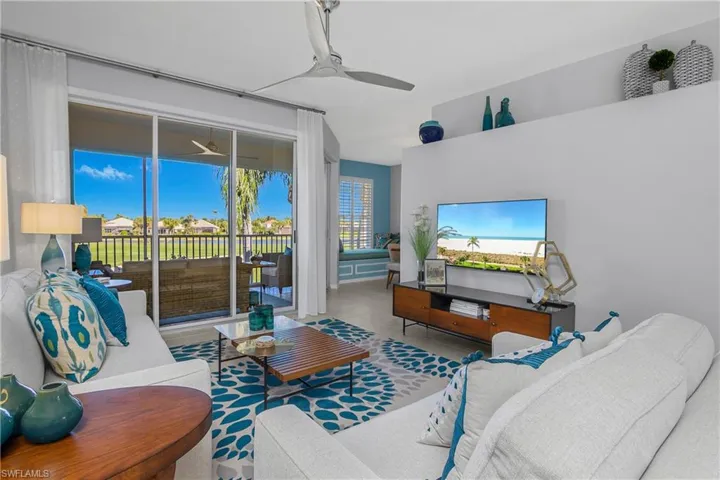 Tiled living area with a ceiling fan