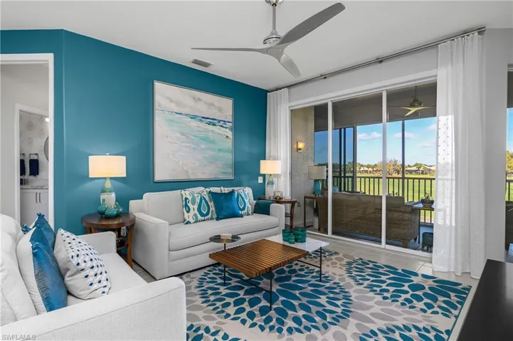 Living area featuring a ceiling fan