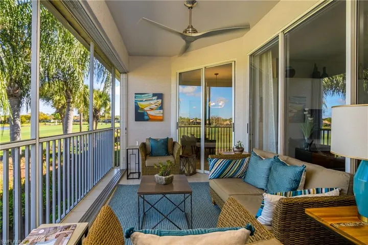 Enclosed Sunroom that opens up offering an outdoor living space and golf course view