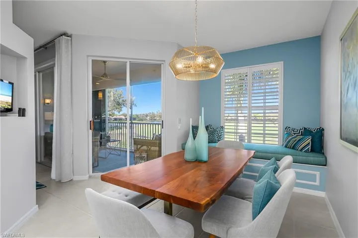 Dining room with ceiling fan and a chandelier could also be a family room