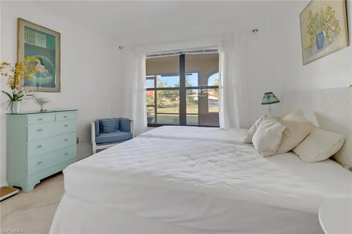 Tiled bedroom with access to exterior