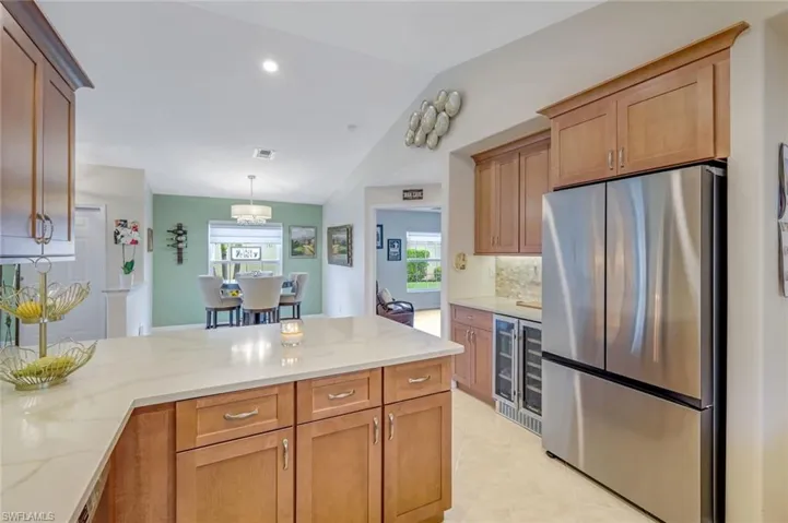 Kitchen with Soft Close Walnut Cabinets Open to Dining Area