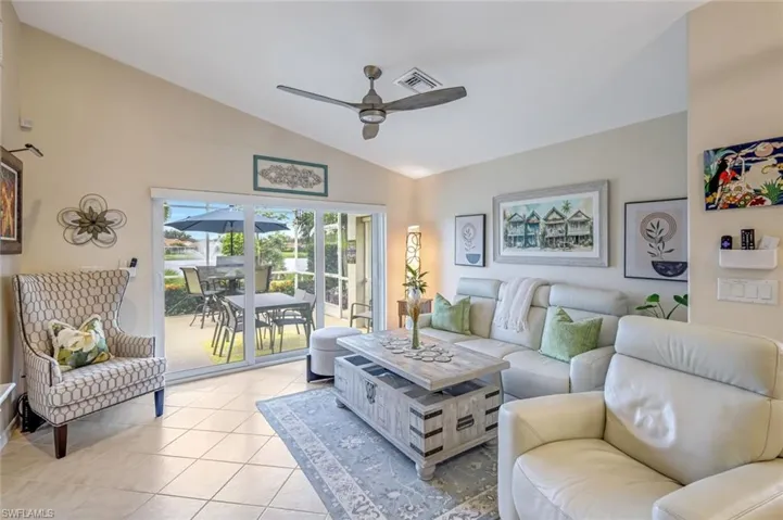 View of the Outdoors and Lake with Fountain from the Living Area