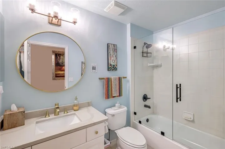 Main Bath with updated Tub Doors and Quartz Counter.