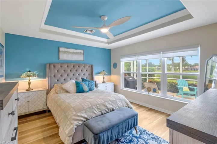 Primary Bedroom with Beautiful View of Outdoor Green Space and Lake