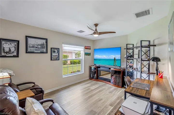 Spacious Den with Luxury Vinyl Flooring Located Off Living Area.