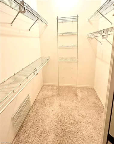Master Closet - large walk in closet with shelving