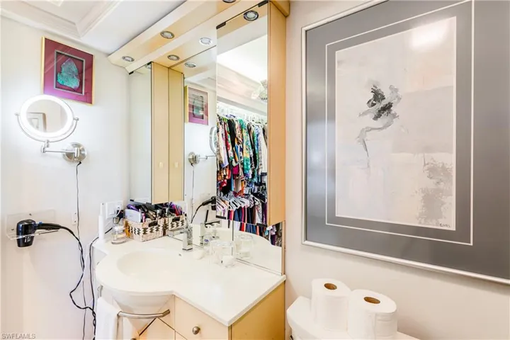 Bathroom with vanity and crown molding
