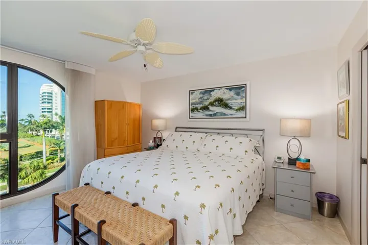 Tiled bedroom with ceiling fan