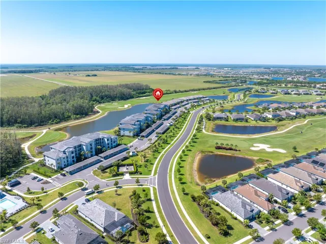 Aerial view featuring a residential view, a water view, and golf course view