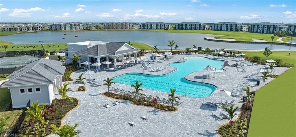 Pool featuring a water view and a patio